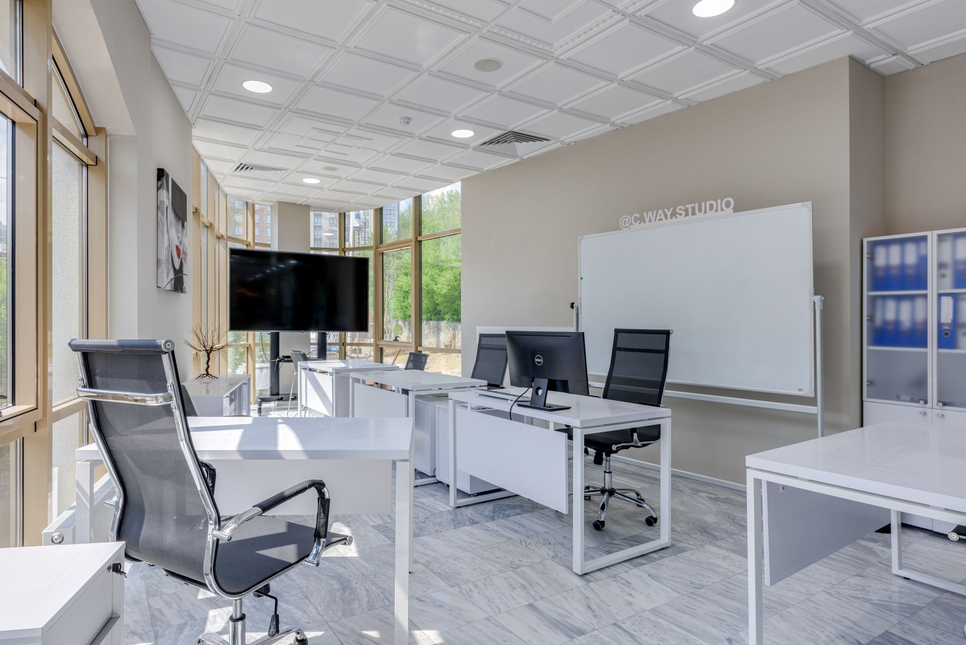 Singapore office with white desks and screens